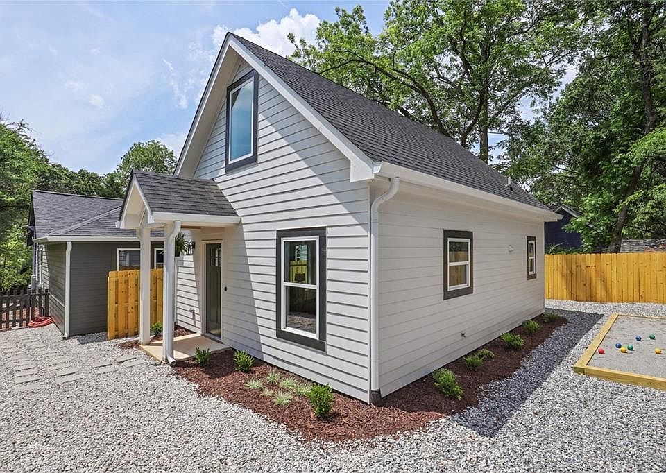 view of front door and open back area, taken from the patio