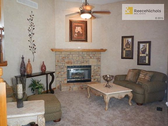 Great Room with Soaring Ceilings, Stone fireplace and wall of wi