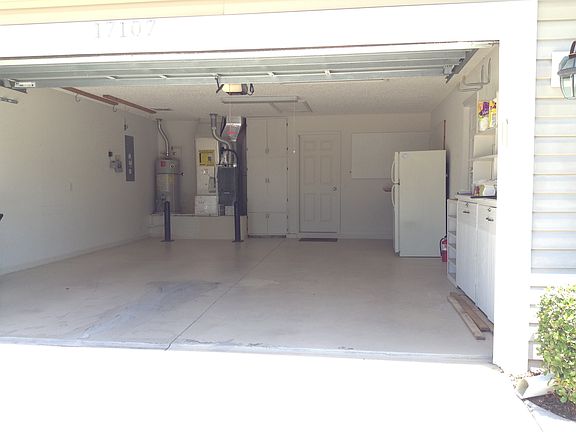 Garage with extra storage and additional refrigerator