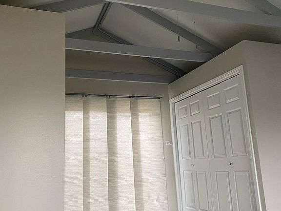 The private deck sliding glass door features flowing panel draperies to adjust for light and privacy. Large closet.