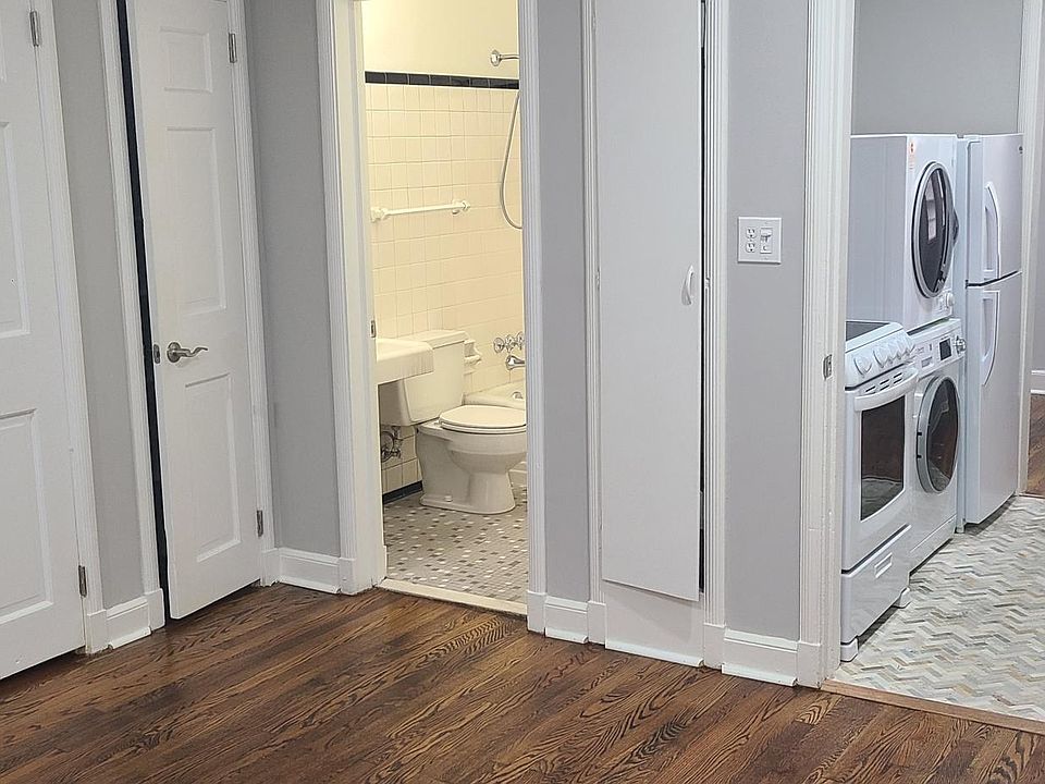 Partial view of bedrooom, bathroom and kitchen