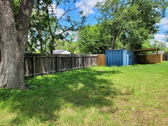 Back yard with storage/workspace container