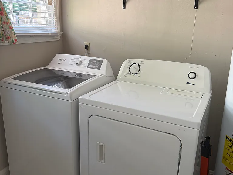 Utility room/mud room with washer dryer and lots of cabinet storage