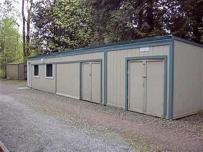Shop/Garage building. Two large storage rooms or shop spaces on the right with the garage at the end