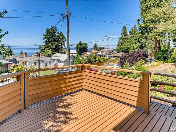 Grab your coffee and relax on this comfortable, sunny front deck. 