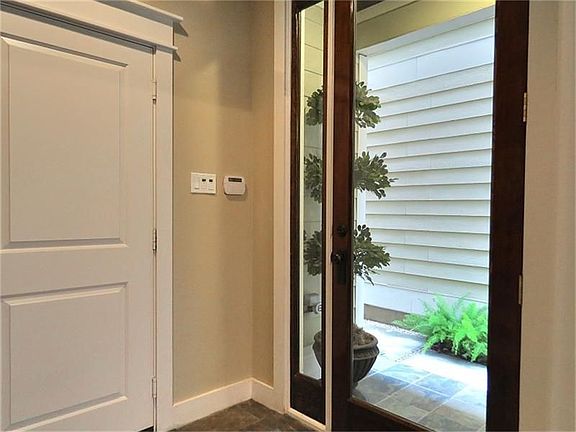 Front door and garage entry.