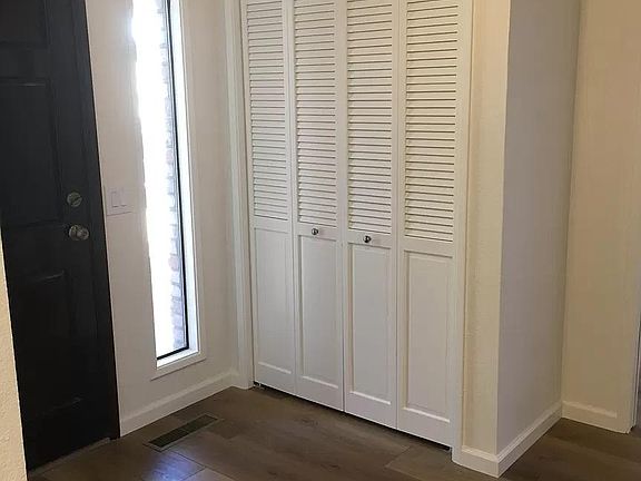 Coat closet in entry hall