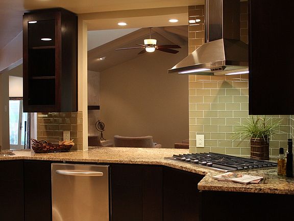 Kitchen opens to den and breakfast area