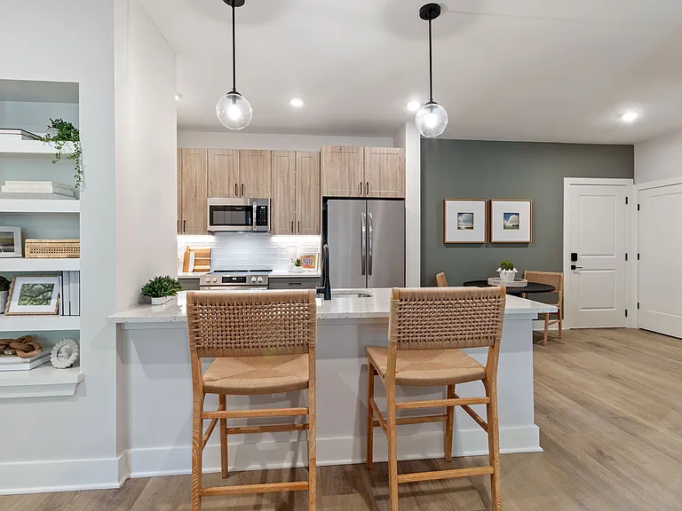 Sleek, two-toned European kitchen cabinets with under-cabinet lighting &amp; soft-close doors &amp; drawers