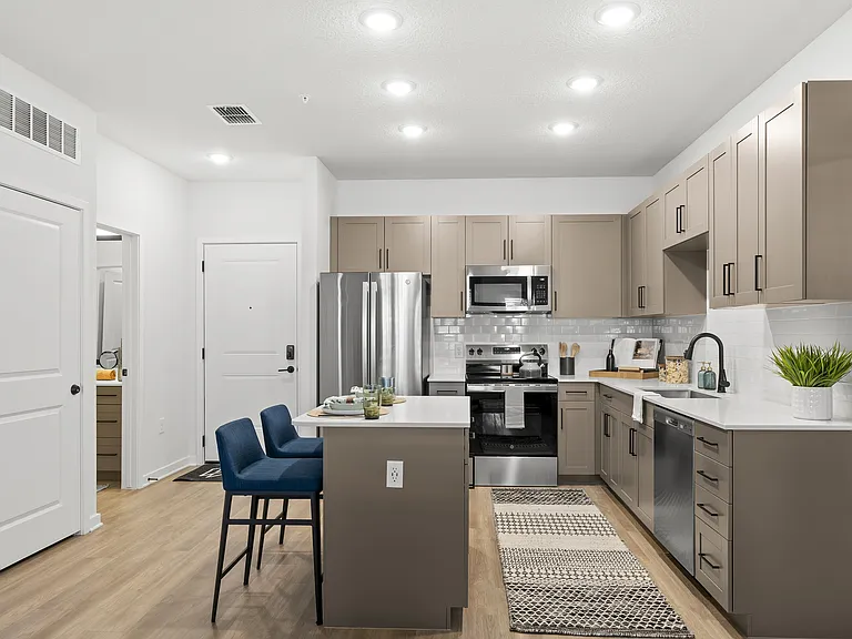Designer kitchens with quartz countertops and prep islands