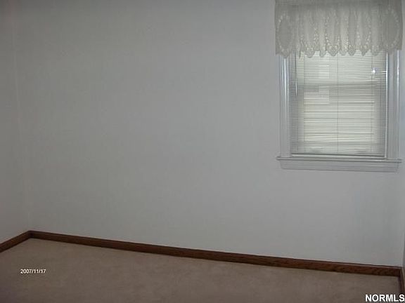 One of two immaculate bed rms. on first floor w/ nuetral decor, vinyl windows!