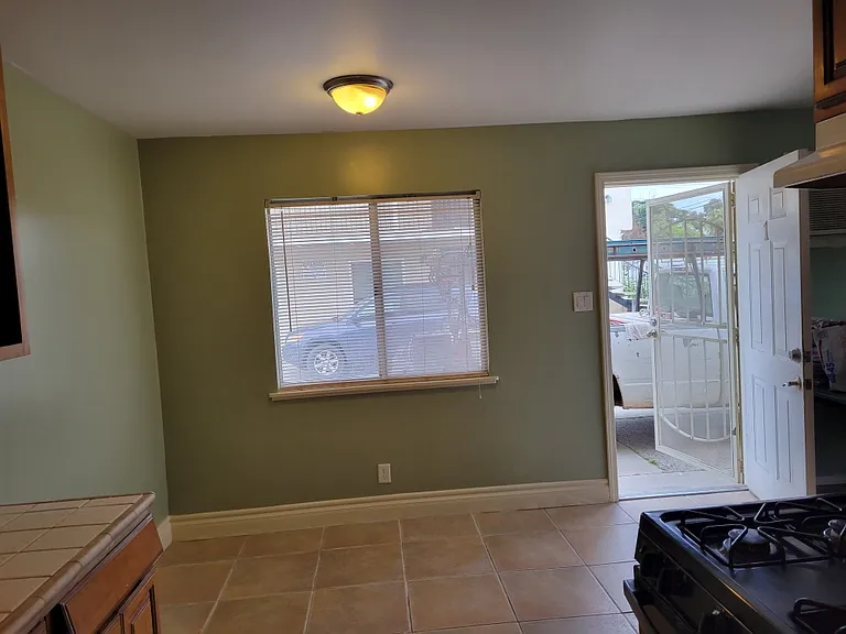 Dining room. Blinds and security door.