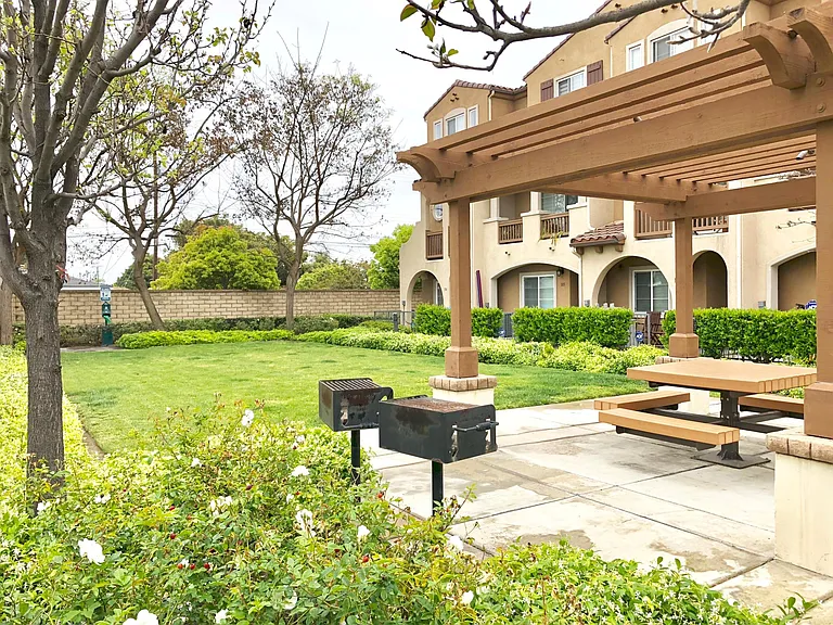 Community field with seating and BBQ Grill