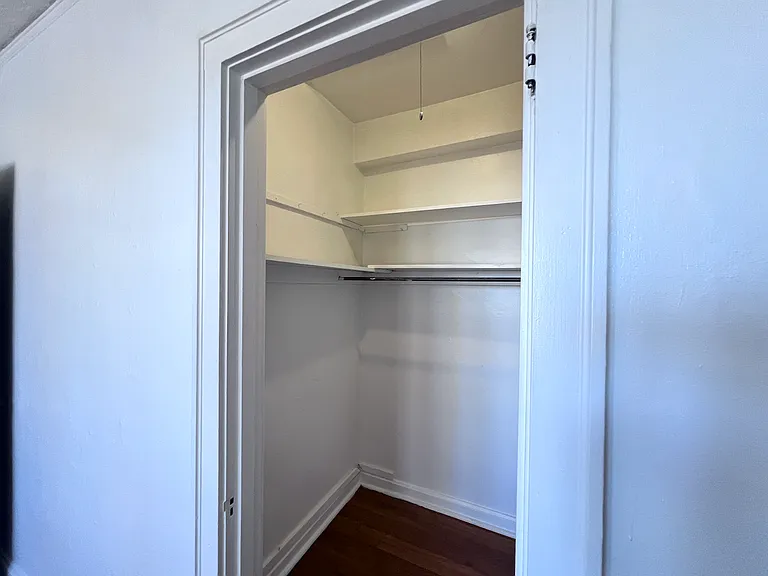 Enjoy the convenience of a spacious walk-in closet complete with built-in shelving