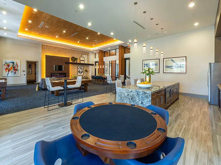 Resident lounge with full catering kitchen, poker table, and billiards