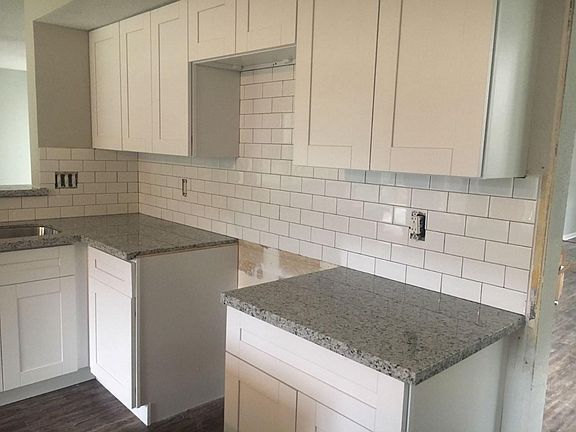 New cabinets, granite, backsplash in kitchen