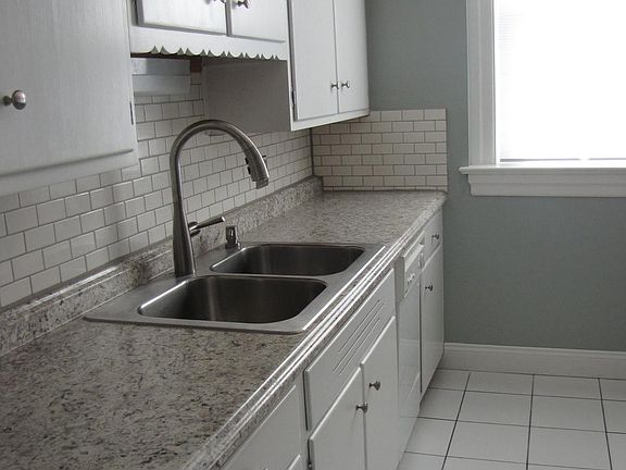 New counters, backsplash and deep stainless steel sink