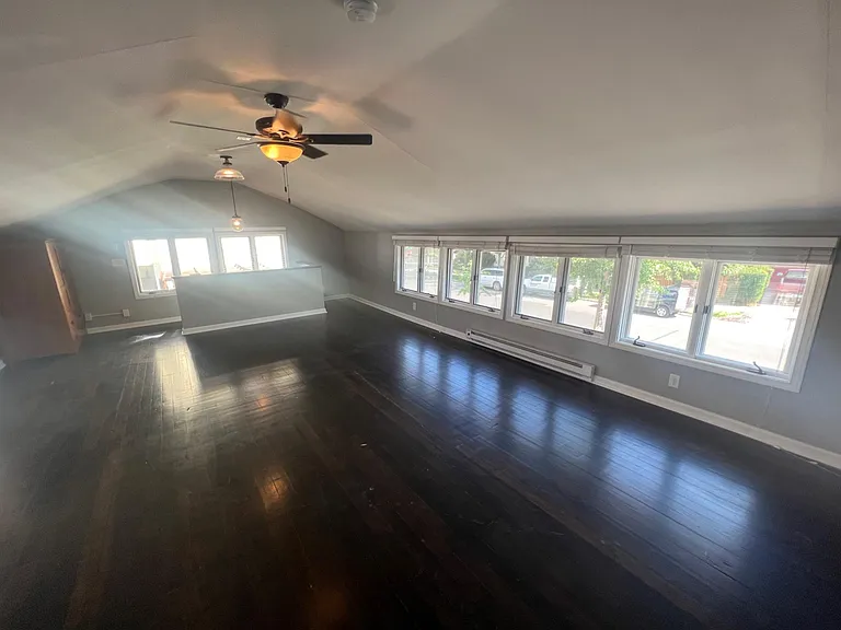 Optional Loft ( Creative / Yoga / Workout / Fun ) space with a Tree-house feel above the garage at $595 / month, includes 20 windows, real Douglas Fir hardwood floors, chic electric fireplace, and Philips Hue smart-lighting.