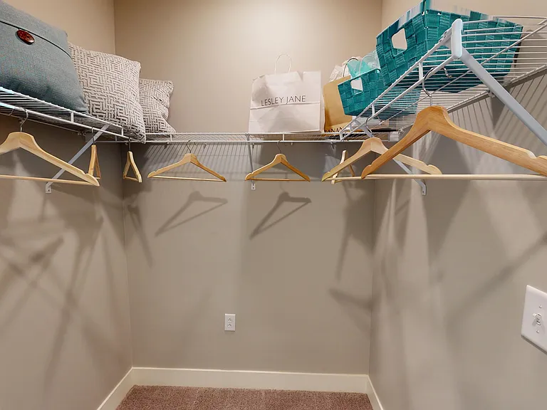 Stay organized with a walk-in closet that offers plenty of space for your wardrobe, shoes, and everyday essentials.