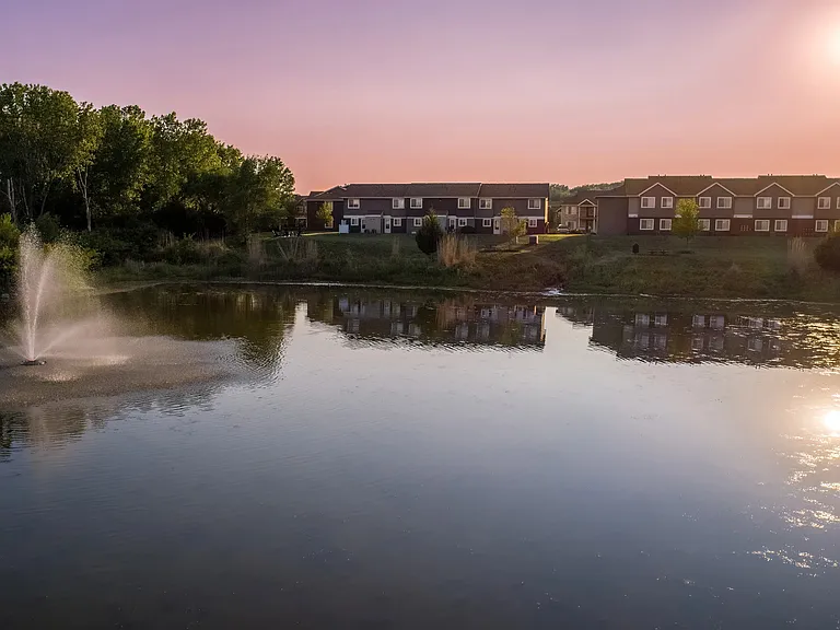 Immerse yourself in the enchanting beauty of our lake views at dusk beckoning you back home to Emory Lakes.