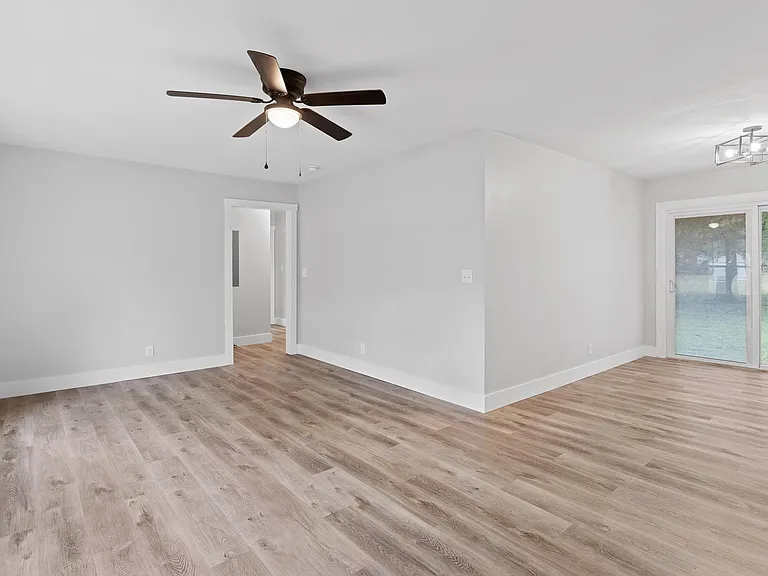 Living/Dining Room - Main Entry area with warm walls, great windows, and continuous luxury flooring