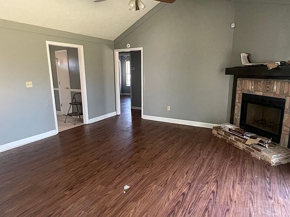 Vaulted ceilings and fireplace in living room