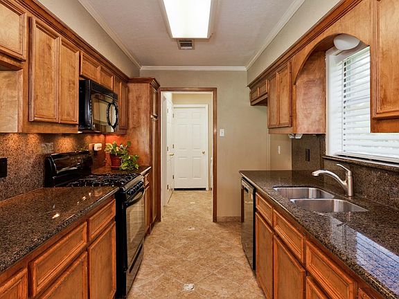 Stainless appliances and "real" wood cabinets.