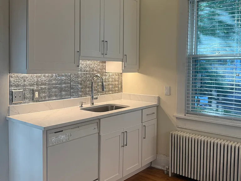Newly renovated kitchen with beautiful quartz counters.