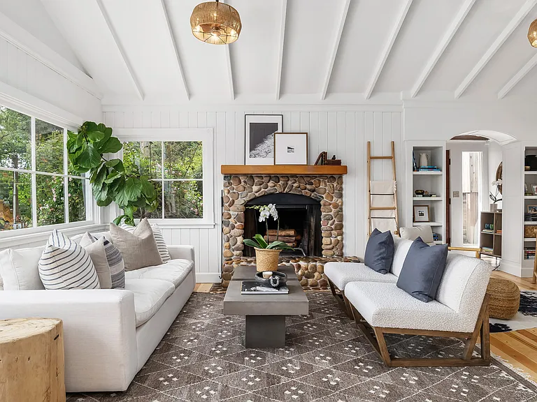 Great room view featuring stone fireplace.
