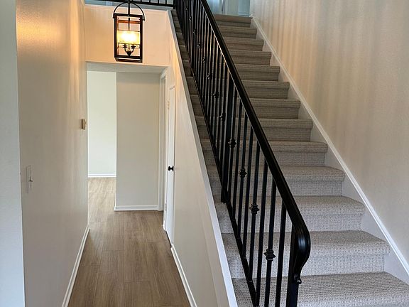Entryway and hallway to the family room. Living room is to the right and dining room is to the left.