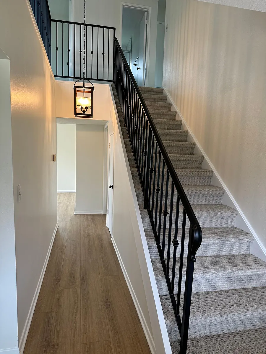 Entryway and hallway to the family room. Living room is to the right and dining room is to the left. - 295 Regis Ave