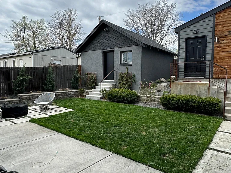 View toward garage #2; firepit and seating area to left.