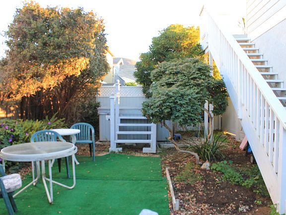 Fenced yard with hot tub