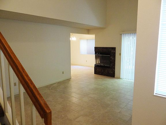 From entry, across living room to dining area, and slider to rear yard.