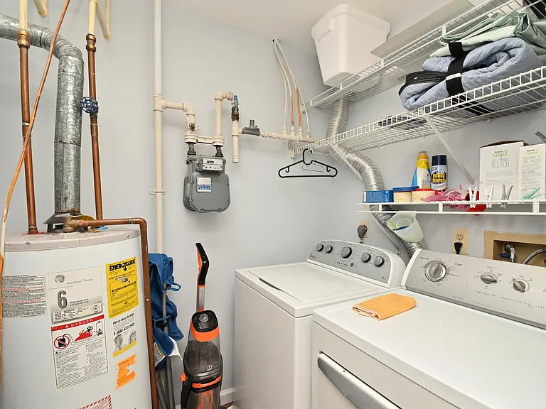Laundry room with extra shelf space.