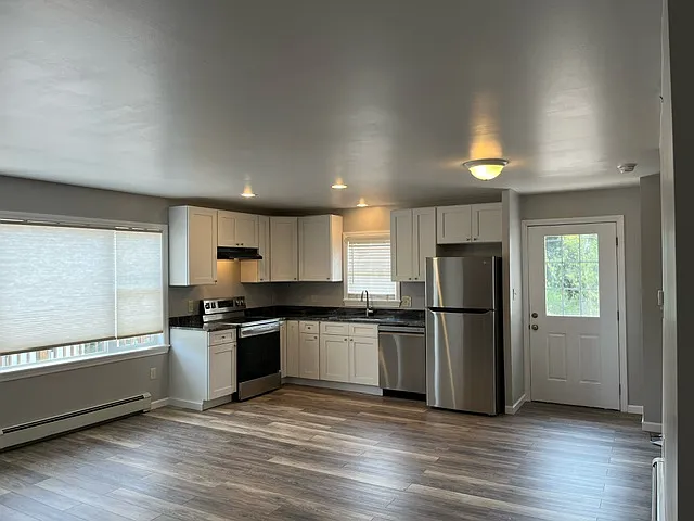New kitchen with granite and stainless steel appliances