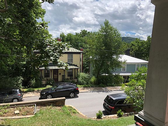 Front porch view -- historic houses and mountains in distance. Watch stunning sunrises from your porch!