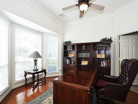 Through the french doors is the study with easy access to hall with the powder room and hall to the 