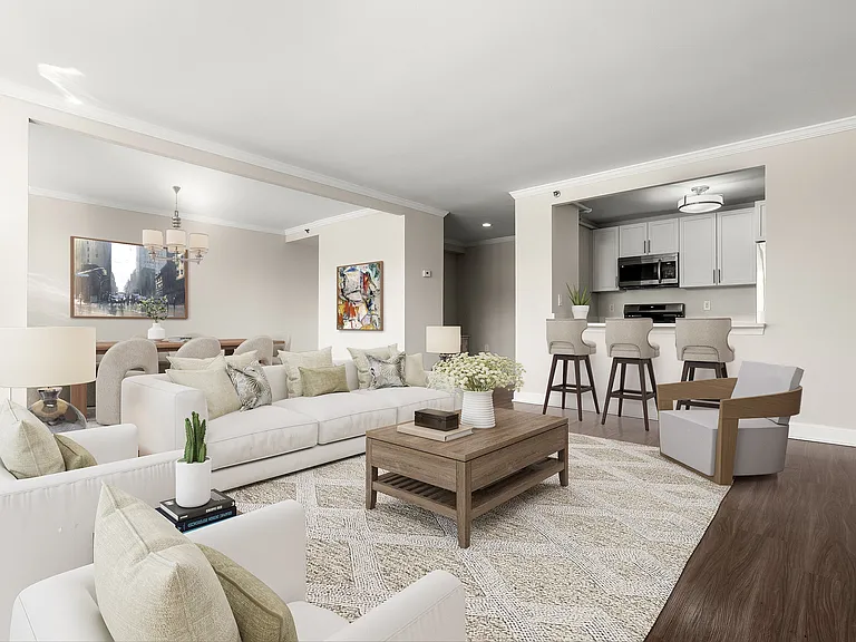 Elegant open-concept living space featuring stylish living and dining areas, and a modern open kitchen with bar seating at Parkside Place, apartments in Cambridge, MA