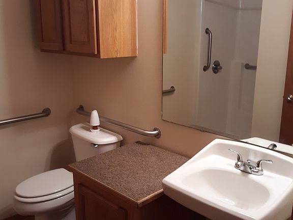 This unit has a similar bathroom space - the sink is clear underneath for easier accessibility.