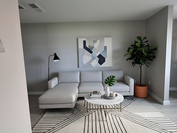 Living room features include large windows which allow tons of natural light!
