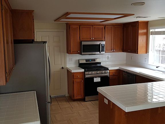 Kitchen. Refinished cabinets and countertops. New Appliances
