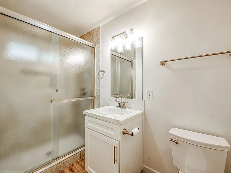Nice Bathroom With Tiled Walk In Shower.