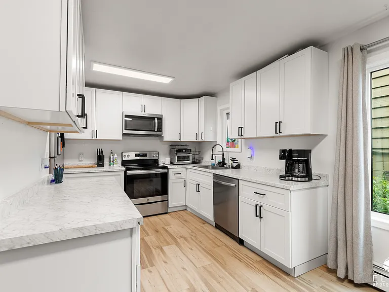 Alternate view of furnished kitchen.