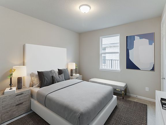 Secondary bedroom features plush carpet and neutral paint.