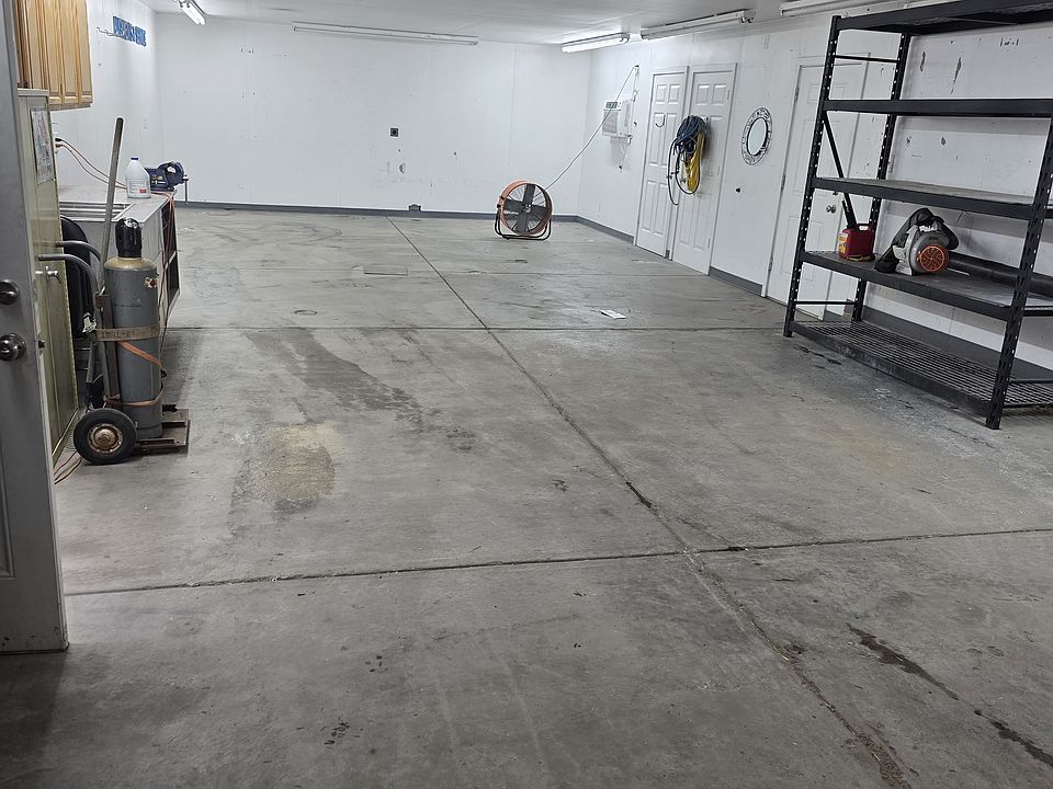 Six car garage with new concrete, two wide and three deep