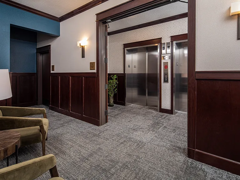 View of double elevators and sitting area at The Whitley apartments.