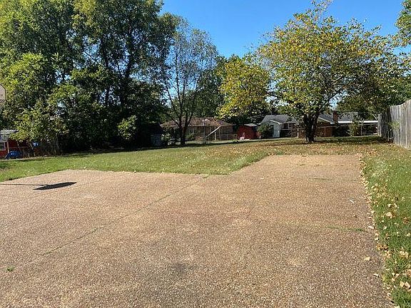 Off street parking on the aggregate pads in the large, level backyard