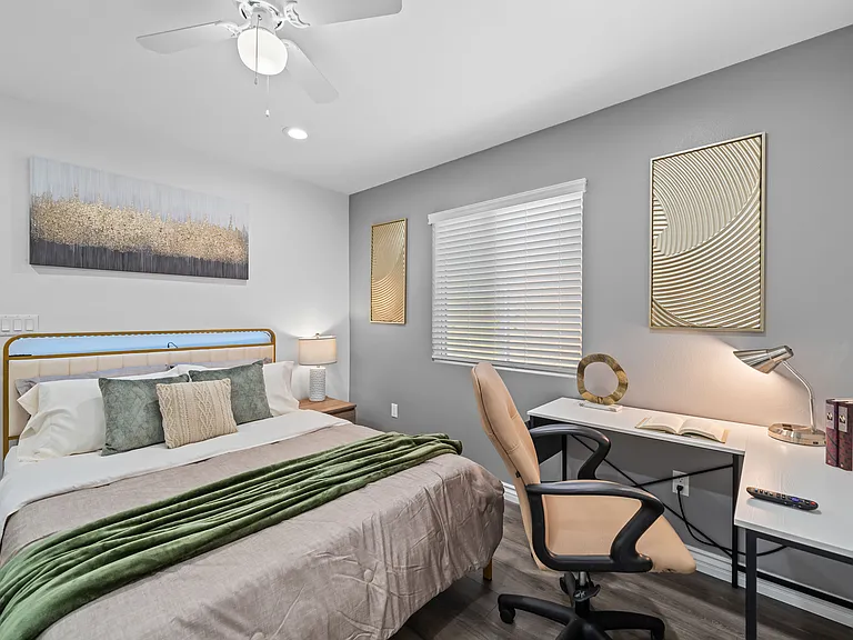 Bright and tidy bedroom featuring a dedicated workspace_perfect for staying productive during your stay.