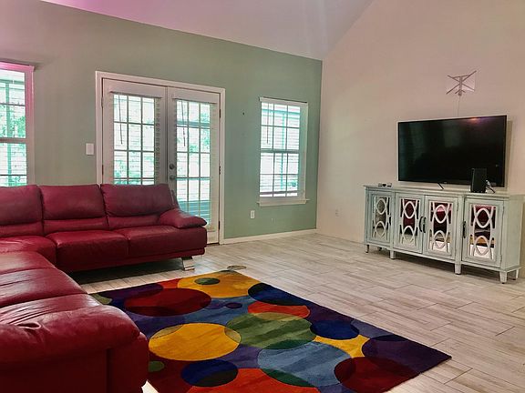 Large living room opens to enclosed back patio